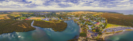Aerial panorama of small coastal town near ocean coastline in, Victoria, Australiaの写真素材