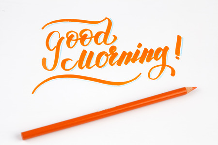 Good Morning creative brush lettering in orange colorの写真素材