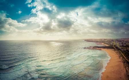 Beautiful cloudscape over ocean coastline at sunset. Kilcunda, Victoria, Australiaの写真素材