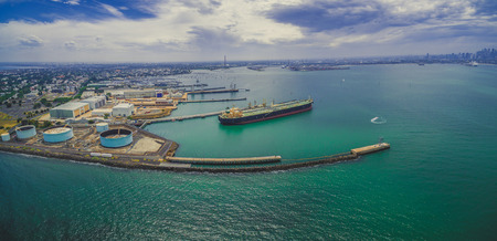 Aerial panoramic view of oil tanker and industrial wharfs near Williamstown suburb in Melbourne Australiaの写真素材
