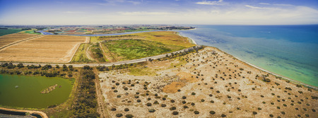 Aerial panorama of Port Phillip Bay coastline near Werribee South, Victoria, Australia on bright summer dayの写真素材