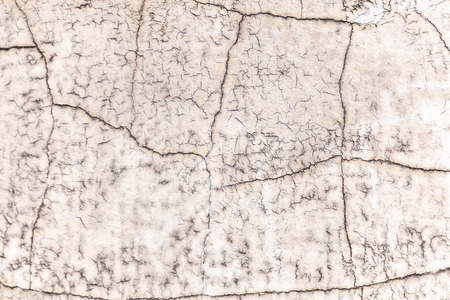 Cracks in paint on wall textured pattern backgroundの写真素材