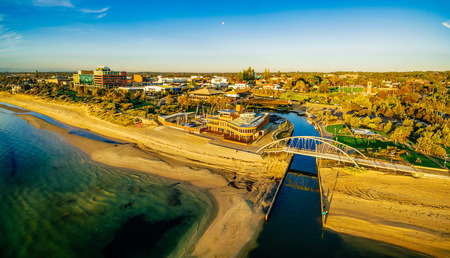 Frankston waterfront at sunset showcasing the famous footbridge over Kananook creek - aerial panorama. Melbourne, Australiaの写真素材