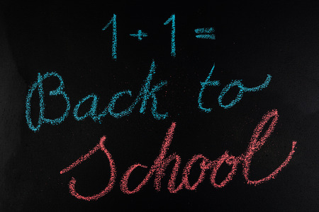 Back to school hand written with colorful chalk on blackboard - education conceptの写真素材