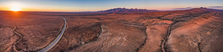 Flinders Ranges peaks at orange sunset - aerial panoramaの写真素材
