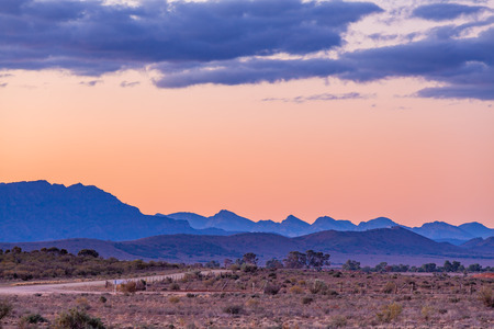 Layers of rugged mountain peaks of Flinders Ranges in South Australia at duskの写真素材