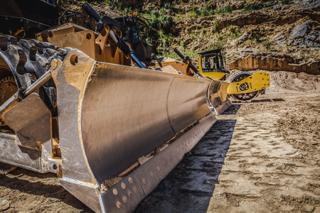 Large industrial bulldozers on construction site