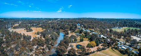 Aerial panorama of Yarra River flowing through Eltham suburb in Melbourne, Australia