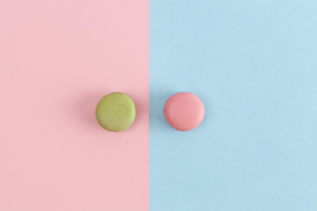 Pink and green macarons on divided background.の写真素材