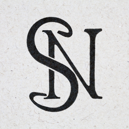 S N monogram, ink bleed on craft paperの写真素材
