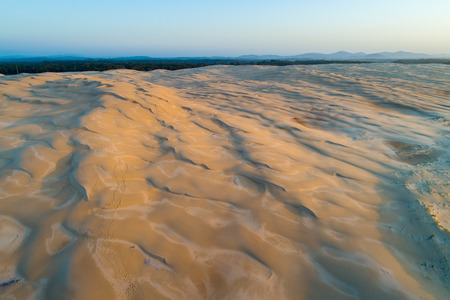 Aerial landscape of sand dunes at sunrise. Anna Bay, New South Wales, Australiaの写真素材