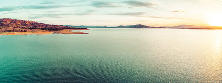 Scenic sunset over beautiful lake in Australia - aerial panoramaの写真素材