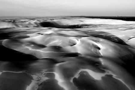 Aerial landscape of beautiful sand dunes at sunrise in black and whiteの写真素材