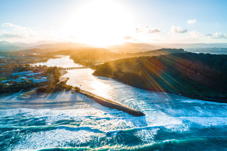 Aerial view of sunset over Tallebudgera creek and Palm Beach suburb in Gold Coast, Queensland, Australiaの写真素材
