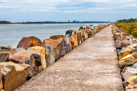 Long stretch of breakwall at Harrington, NSW, Australiaの写真素材