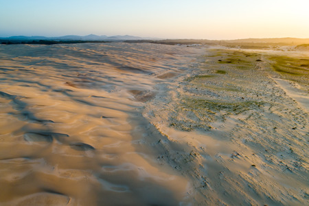 Aerial view of sand dunes near the ocean at sunset. Anna Bay, New South Wales, Australiaの写真素材