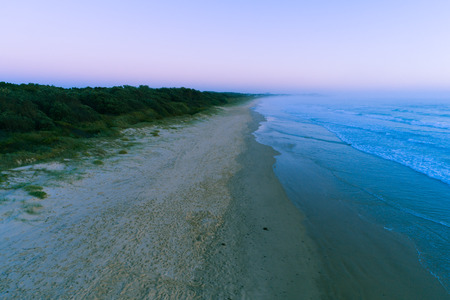 Ocean coastline at dawn - aerial view with copy spaceの写真素材