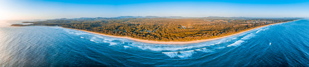 180 Aerial panorama of ocean coastline at sunrise. Arrawarra and Corindi Beach in New South Wales, Australiaの写真素材