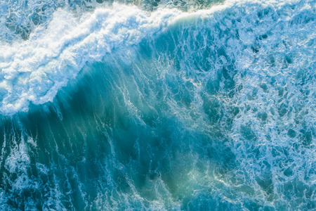 Aerial view of stormy ocean at sunsetの写真素材