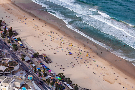 Aerial view of people on Surfers Paradise ocean beach next to the marketの写真素材