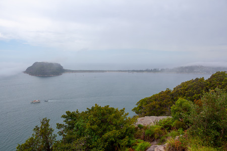 Barrenjoey Lighthouse viewed from West Head lookout at ku-ring-gai Chase National Park in Sydney, Australiaの写真素材
