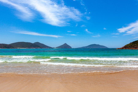 Perfect place for summer vacation - turquoise ocean waves and sandy beach on bright sunny day. Fingal Bay, New South Wales, Australiaの写真素材