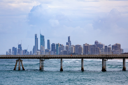 Gold Coast city skyline above a long pier - unusual viewpointの写真素材