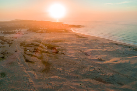 Sunrise over ocean beachの写真素材