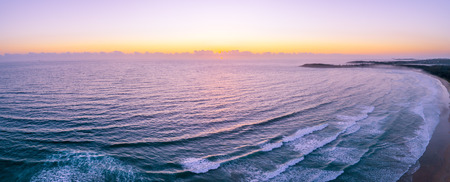 Wide aerial panoramic landscape of sunset over ocean with copy spaceの写真素材