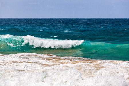 Crushing wave and blue skyの写真素材