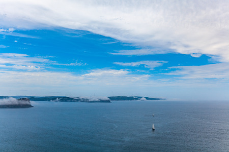 Sailboats sailing across Broken Bay in Sydney, Australiaの写真素材