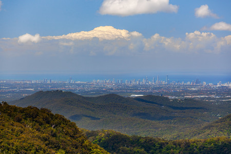 Panoramic view of Gold Coast city high rise and Springbrook National Park on bright sunny day. Queensland, Australiaの写真素材