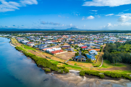 Nice houses on river bank in Harrington, New South Wales, Australiaの写真素材