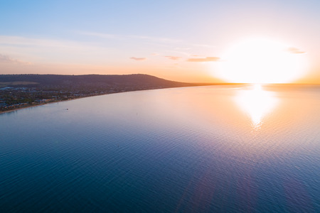 Sunset over coastline - aerial view with copy spaceの写真素材