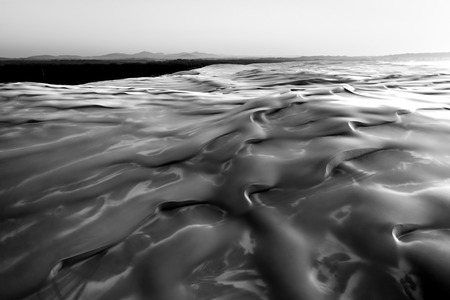 Sand dunes at sunrise in black and whiteの写真素材