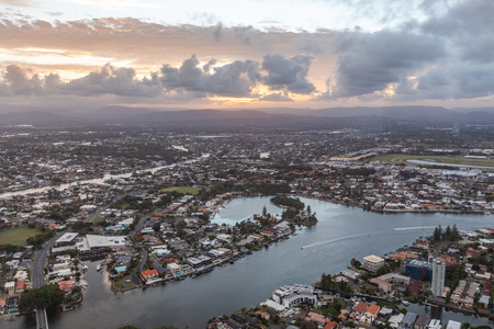 Aerial view of Nerang river and Gold Coast at sunsetの写真素材