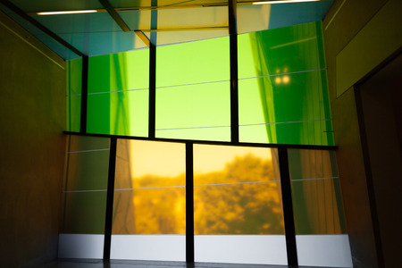 Colorful tall windows of modern building interiorの写真素材