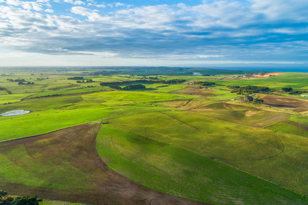 Scenic countryside near the ocean at sunsetの写真素材