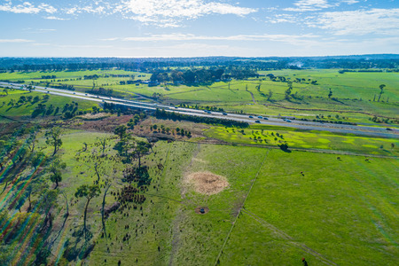 Aerial view of green pastures and rural highway at Mornington Peninsula Victoria, Australiaの写真素材