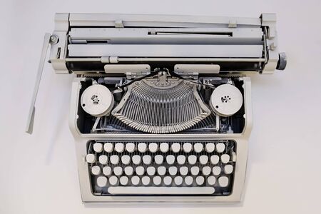 Vintage white typewriter on white background - top viewの写真素材