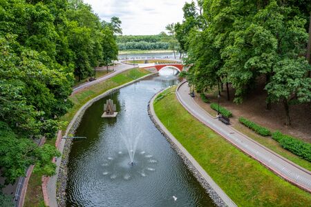 Swan pond with fountain in the city park of Gomel, Belarusの写真素材