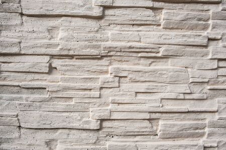 Decorative white painted thin bricks wall backgroundの写真素材