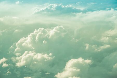 Aerial view looking down at beautiful fluffy cloudsの写真素材