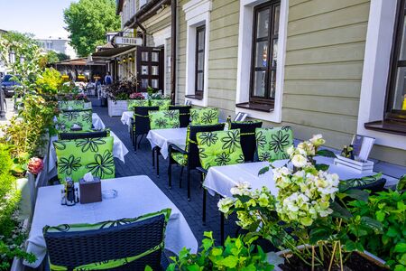 Minsk, Belarus - July 2, 2019: Cozy outdoor cafe tables in Minsk downtownのeditorial素材