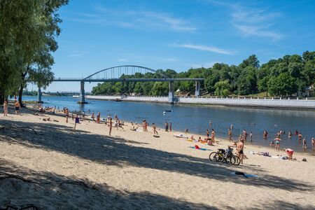 Gomel, Belarus - June 19, 2019: People relaxing on the beach of river Sozh in summerのeditorial素材
