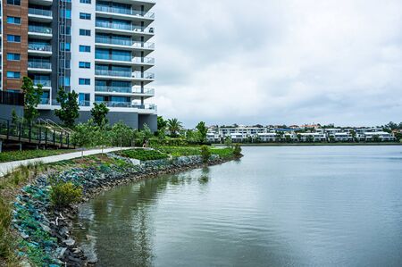 Lake and luxury housing at Varsity Lakes suburb in Queensland, Australiaの写真素材