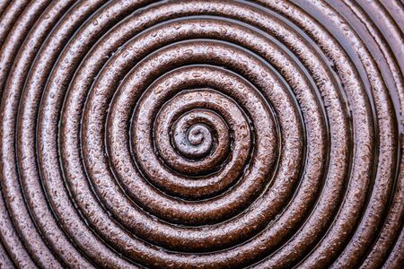 Wet metal spiral abstract background overlayの写真素材