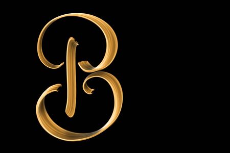 Golden capital letter B isolated on black with copy space - hand letteringの写真素材