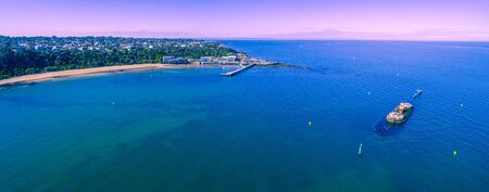 Aerial panoramic landscape of historic shipwreck and beautiful Black Rock coastline in Melbourne, Australiaの写真素材