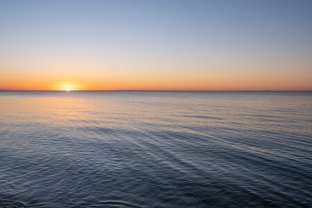 Minimalistic sunset over sea with copy spaceの写真素材